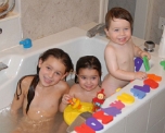 Three cousins in a tub